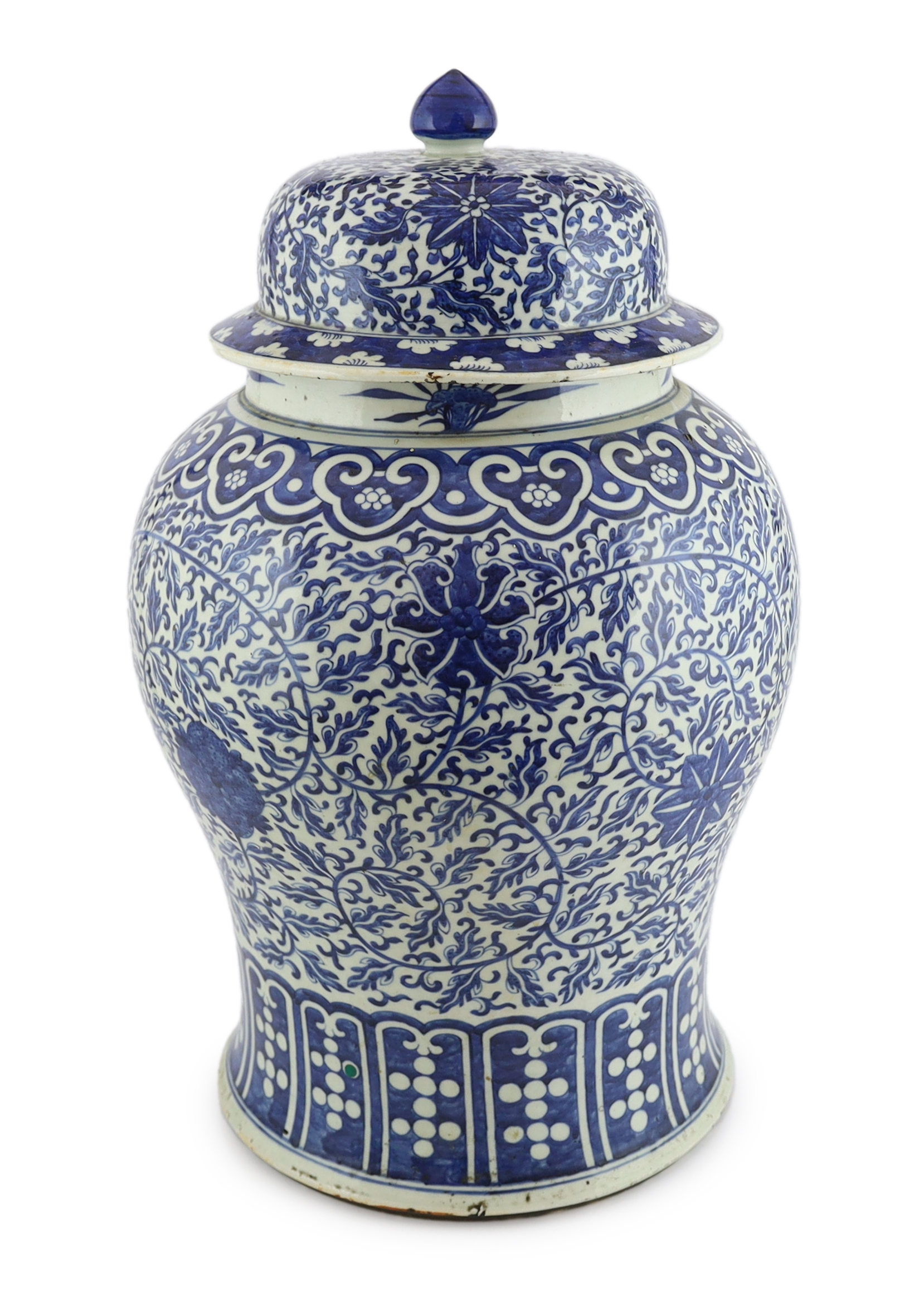 A massive Chinese blue and white ‘lotus’ vase and cover, 18th/19th century, broken and glued